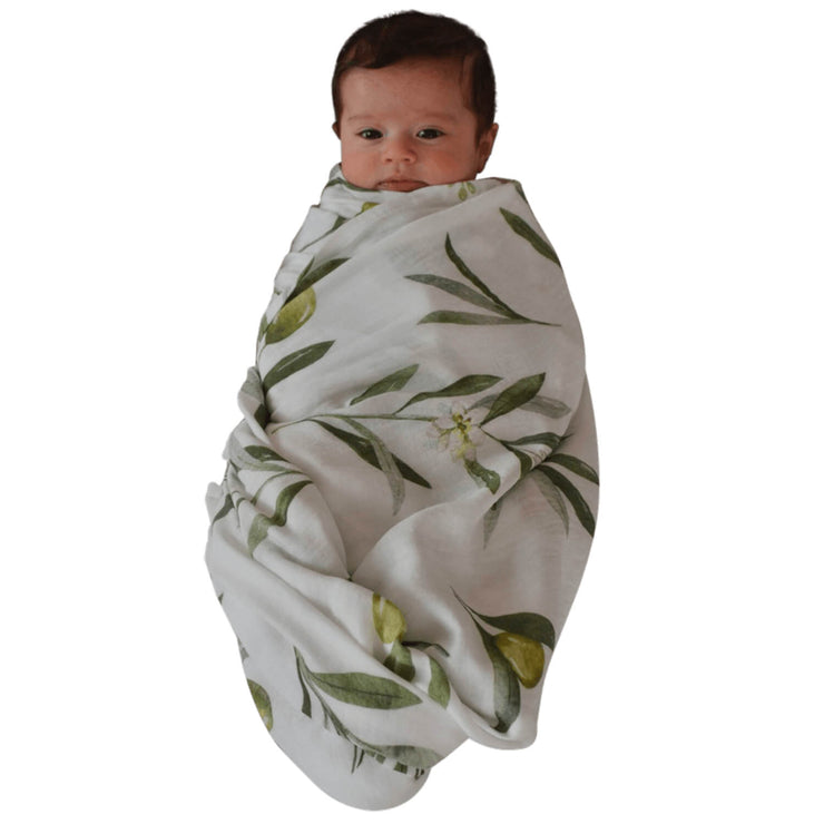 Baby Wrapped in the Olive Swaddle by The Swaddle Society