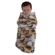 Baby Wrapped in the Yum Cha Swaddle by The Swaddle Society